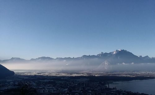 Scenic view of mountains against blue sky