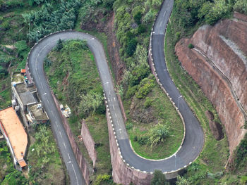 High angle view of road amidst trees in forest