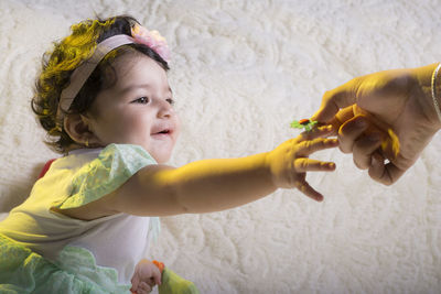 Portrait of cute girl with arms outstretched