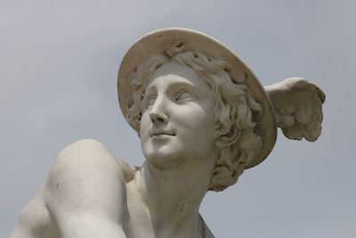 Low angle view of statue against sky