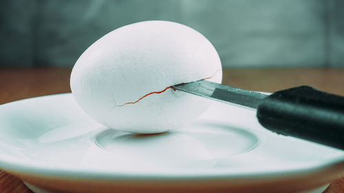 Close-up of egg in plate on table