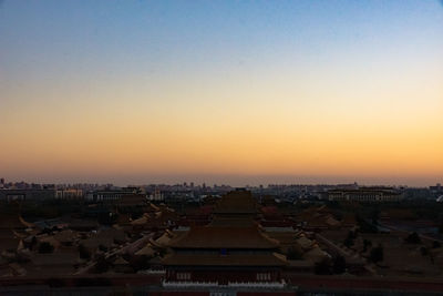 Cityscape against sky during sunset