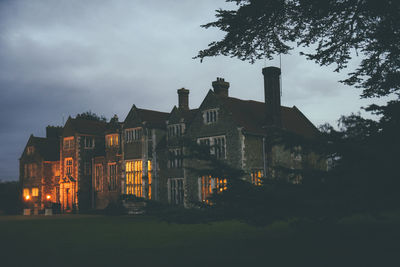 Low angle view of buildings against sky at dusk