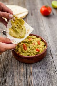 Close-up of hand preparing food