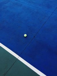 High angle view of yellow ball on bed