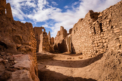 Kasbah stone antique lost sahara desert blue sky dust gone archeology culture historic