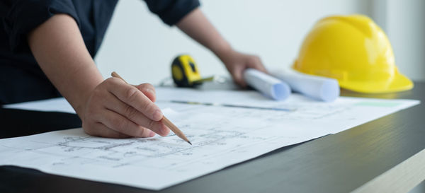 Midsection of man working at office