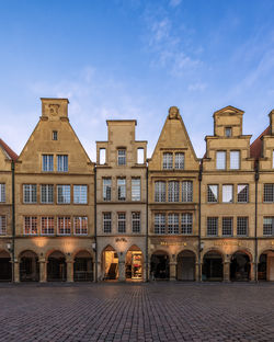 Old buildings in münster against sky