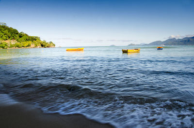 Scenic view of sea against clear sky