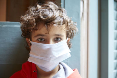 Close-up portrait of boy wearing mask