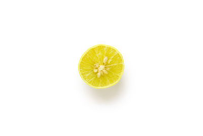 High angle view of lemon slice over white background