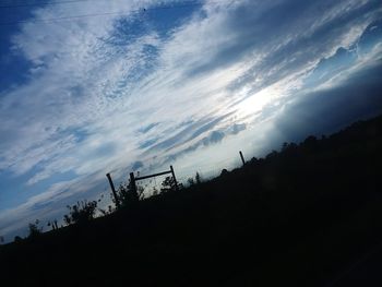 Low angle view of silhouette trees against sky at sunset