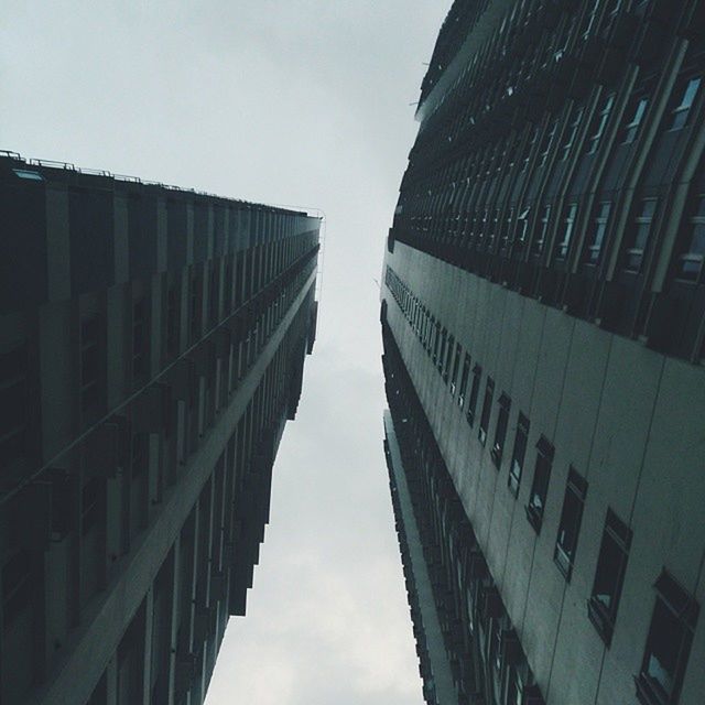 building exterior, architecture, built structure, low angle view, sky, city, modern, office building, building, skyscraper, tall - high, window, tower, reflection, cloud - sky, glass - material, day, outdoors, residential building, no people