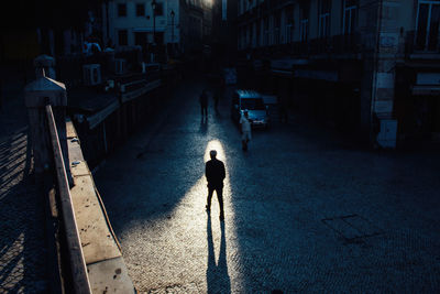 High angle view of people walking on street in city