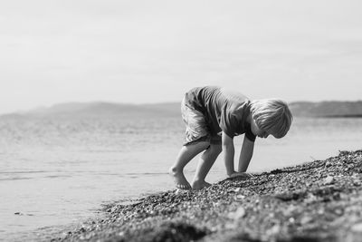 Surface level of boy at sea shore