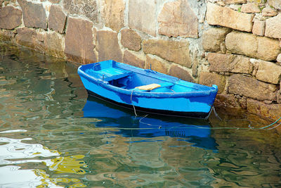 High angle view of boat floating on water