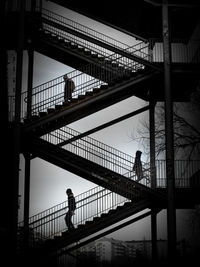 People walking on footbridge