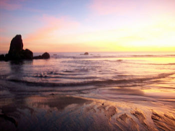 Scenic view of sea at sunset