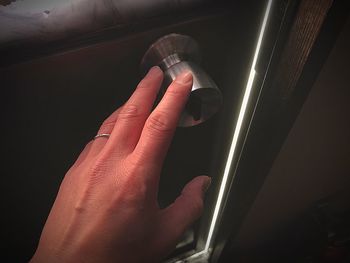 Close-up of hand holding camera