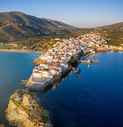 Aerial view of sea and buildings in town