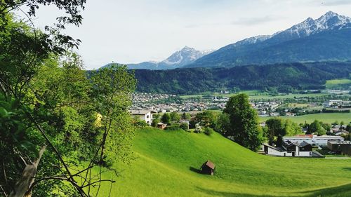 Scenic view of landscape and mountains against sky