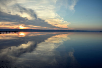 Scenic view of lake against romantic sky at sunset