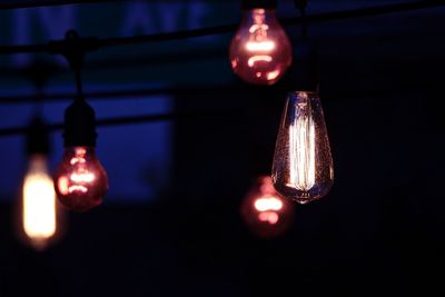 Close-up of illuminated light bulb