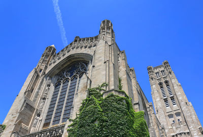 Low angle view of historical building against blue sky