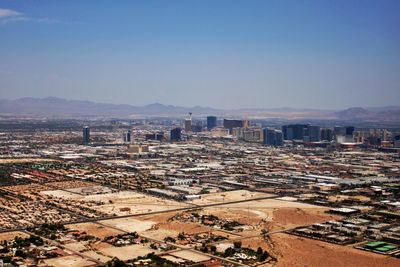 High angle view of buildings in city against clear sky