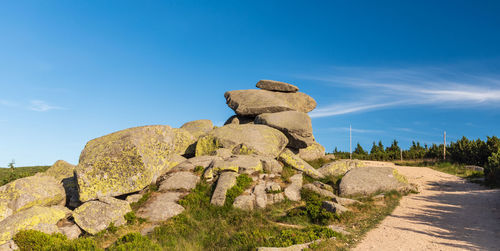 Low angle view of rock formation against sky