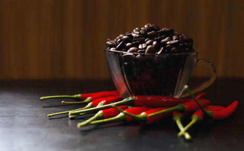 Close-up of red chili peppers on table