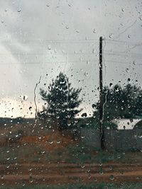 Full frame shot of wet glass window in rainy season