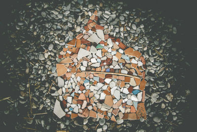 Close-up of heart shape stone on wall