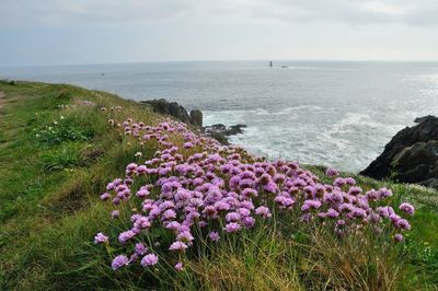 Scenic view of sea against cloudy sky