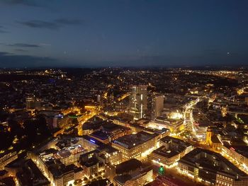 High angle view of illuminated buildings in city at night