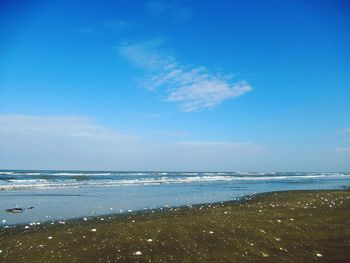 Scenic view of sea against blue sky