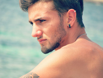 Close-up of young man looking away