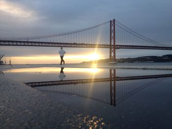 View of suspension bridge at sunset