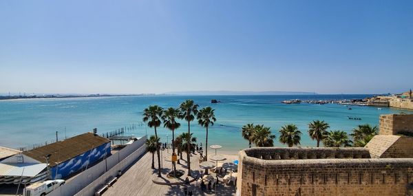 Scenic view of sea against clear blue sky