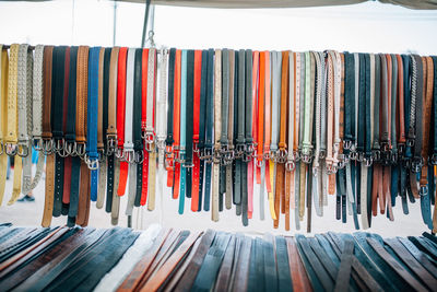 Multi colored belts at market for sale