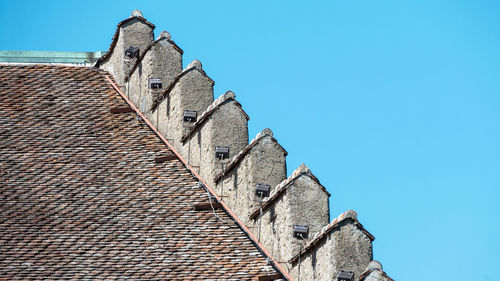 Low angle view of building against clear blue sky