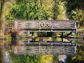 View of old wooden structure in lake