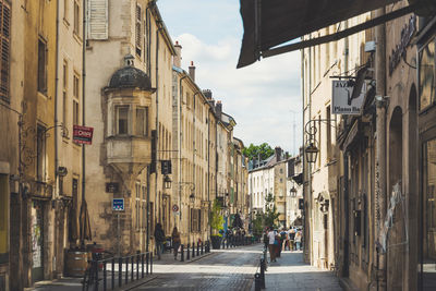 Narrow street amidst buildings in town