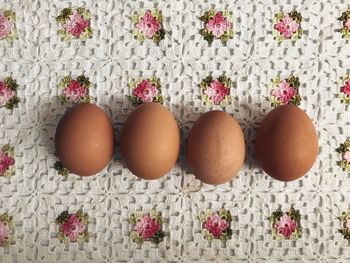 Close-up of eggs on tablecloth