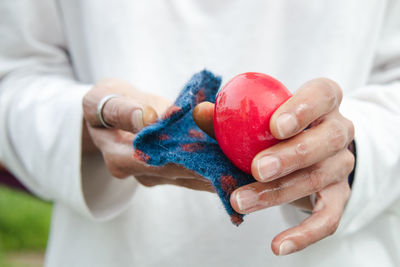 Close-up of hand holding ice cream