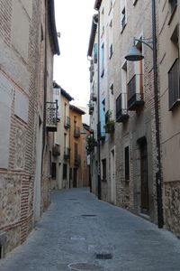 Narrow alley amidst buildings in city