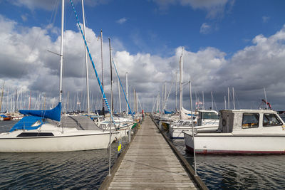 Boats moored at harbor