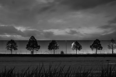 Scenic view of sea against storm clouds