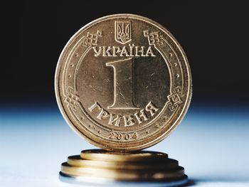 Close-up of coin against black background