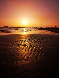 Scenic view of beach against sky during sunset